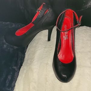 Black heels 5 inch with ankle strap. Red insoles.